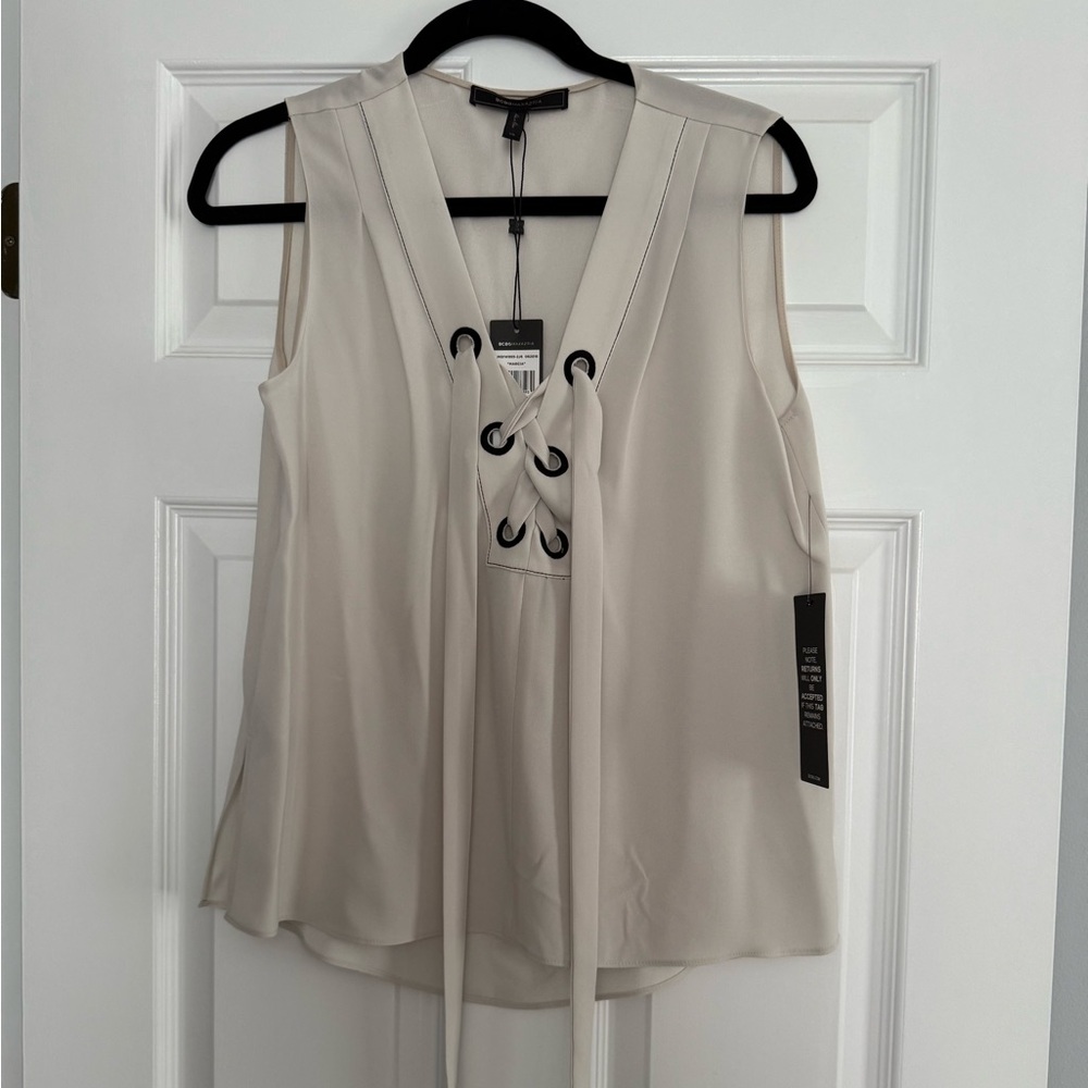 BCBGMaxAzria Cream Lace-Up Blouse. Size XS. NWT